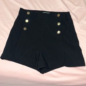 Black high waisted shorts. Zipper on left side. Never worn. Perfect condition.
